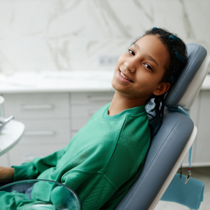 Teen smiling at pediatric orthodontist in Naperville